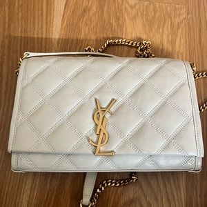Authentic YSL clutch in beige.